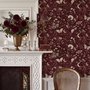 Pink butterflies wallpaper on a claret ground with cream flowers, moons, stars and spotted mushrooms.