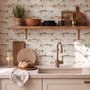 Watercolor fish wallpaper with trout, seashells and pale aqua washes on a warm cream ground
