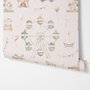 Children's playroom wallpaper with pastel Ferris wheel, carousel horses, tents and balloons on blush pink