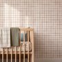 Soft brown wallpaper with pale beige gingham checks on a warm cream off-white ground
