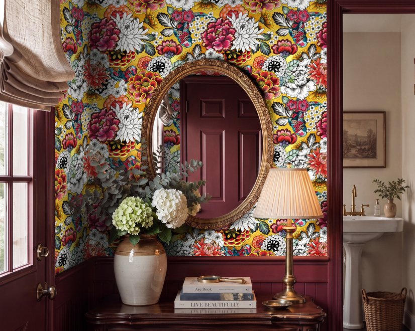 Floral and fish wallpaper with coral blooms, teal fish and black white flowers on metallic mustard-gold ground