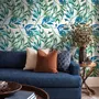 Dark olive green wallpaper with teal and cobalt watercolour lance leaves on a white ground