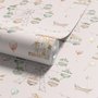 Children's playroom wallpaper with pastel Ferris wheel, carousel horses, tents and balloons on blush pink