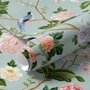 Chinoiserie wallpaper with peach birds, orchids and peonies on a pale duck egg blue ground