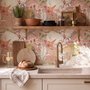 Pink tropical wallpaper with ivory fan palms, orchids, coral blossoms and sage foliage on dusty rose