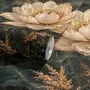 Ivory lotus flowers and seed pods on charcoal teal lily pads in a botanical lotus wallpaper mural