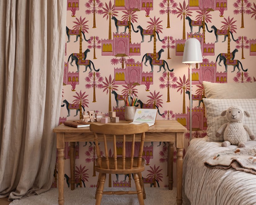 Tropical foliage wallpaper with black panthers, pink palace facades and ochre palms on pale peach