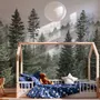 Misty mountain wallpaper mural with tall pine trees, layered green forest and pale foggy ridges
