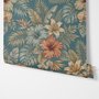 Blue tropical wallpaper with hibiscus, orchids, lilies, monstera leaves and palm fronds on a deep teal-blue ground