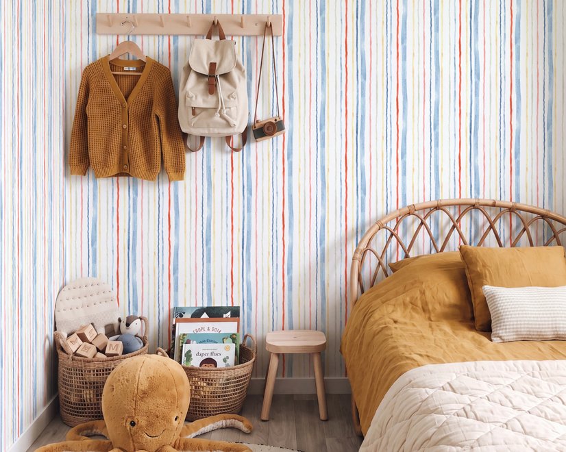 Blue and light blue wallpaper with hand-painted vertical watercolour stripes on a clean white ground