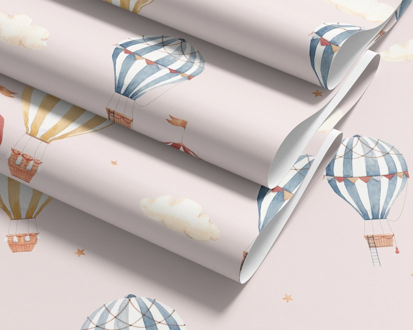 Hot air balloon nursery room wallpaper with watercolour balloons, clouds and stars on a soft blush-pink ground