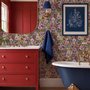 Bold wallpaper for powder room with pop art female faces, pink flowers, black comic panels, mustard, teal and fuchsia details