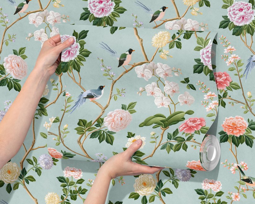 Chinoiserie wallpaper with peach birds, orchids and peonies on a pale duck egg blue ground