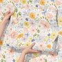 Spring floral wallpaper with pastel watercolour flowers and sage leaves on a clean white ground