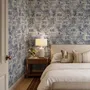 Jungle wallpaper with animals in navy toile, showing tigers, elephants and monkeys on an ivory cream ground