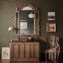 Black wallpaper with gold vertical chain link Art Deco repeat on a textured charcoal ground