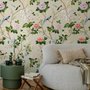 Chinoiserie wallpaper with blue-grey birds, pink peonies, white orchids and green branches on ivory-cream ground