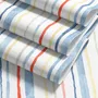 Blue and light blue wallpaper with hand-painted vertical watercolour stripes on a clean white ground