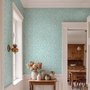Aqua fern wallpaper with overlapping icy blue palm fronds on a pale aqua ground