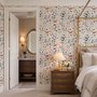 Watercolour floral wallpaper repeat with navy, blue, blush and peach wildflowers on warm cream