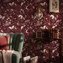 Pink butterflies wallpaper on a claret ground with cream flowers, moons, stars and spotted mushrooms.