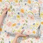 Spring floral wallpaper with pastel watercolour flowers and sage leaves on a clean white ground