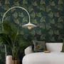 Dark green wallpaper with metallic antique-gold etched ginkgo leaves on a textured forest-green teal ground