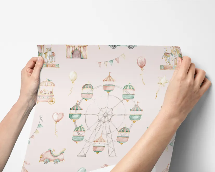 Children's playroom wallpaper with pastel Ferris wheel, carousel horses, tents and balloons on blush pink