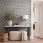 Cream colored wallpaper with denim blue geometric totem stripe repeat on a linen texture ground