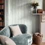 Blue floral stripe wallpaper with pale sky-blue bell flowers, green vines and sage bands on white