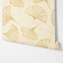 Ginkgo leaf wallpaper with ochre-gold linework on warm ivory and cream parchment ground