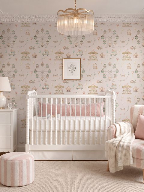 Children's playroom wallpaper with pastel Ferris wheel, carousel horses, tents and balloons on blush pink