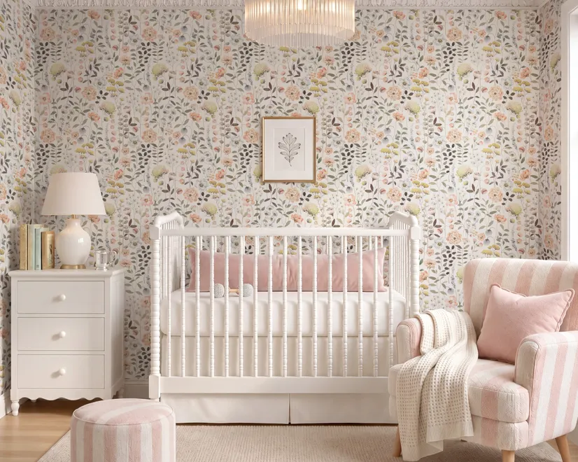 Watercolour wildflower wallpaper with pastel flowers and sage leaves on a white ground