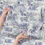Jungle wallpaper with animals in navy toile, showing tigers, elephants and monkeys on an ivory cream ground