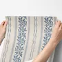 Blue wallpaper with indigo botanical stripework, pinstripes and dotted borders on warm cream parchment