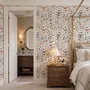 Watercolour floral wallpaper repeat with navy, blue, blush and peach wildflowers on warm cream