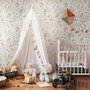 Watercolour wildflower wallpaper with pastel flowers and sage leaves on a white ground
