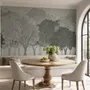 Light gray wallpaper mural with layered ink-wash woodland trees, falling leaves and birds