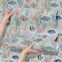 Modern coastal wallpaper with watercolour tropical fish, coral, seaweed, shells and bubbles on light aqua-blue