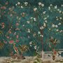 Floral wallpaper with birds in a teal chinoiserie garden with blossoms, pheasant, palms and stone railings