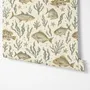 Watercolour fish wallpaper with sage seaweed, coral and starfish on a warm cream background