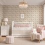 Pink wallpaper with watercolour blush, coral and yellow wildflowers, sage leaves and stems on a warm cream-white ground.