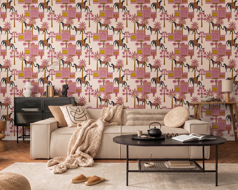 Tropical foliage wallpaper with black panthers, pink palace facades and ochre palms on pale peach