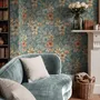 Blue tropical wallpaper with hibiscus, orchids, lilies, monstera leaves and palm fronds on a deep teal-blue ground