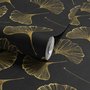 Black wallpaper with antique metallic gold ginkgo leaves on a mottled charcoal ground