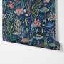 Aquarium fish tank wallpaper repeat with tropical fish, coral, seaweed, shells and bubbles on deep navy blue