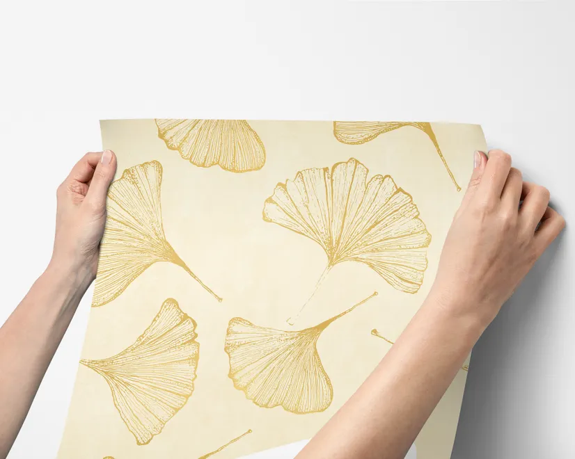 Ginkgo leaf wallpaper with ochre-gold linework on warm ivory and cream parchment ground