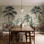 Vintage forest wallpaper mural with blue-grey trees, ivory blossom, red plants and toadstools around a misty path