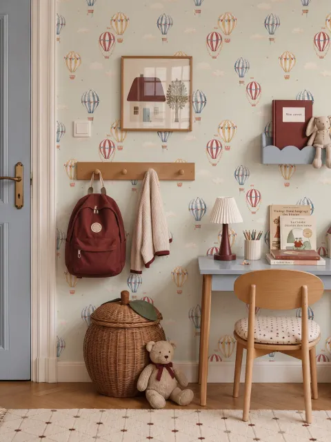Watercolor blue wallpaper with hot air balloons, cream clouds and peach stars on pale sage green