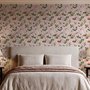 Cute pink wallpaper with birds, tan branches, green leaves and ivory, coral and lilac flowers.